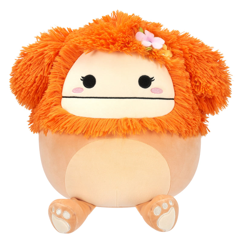 Squishmallows 30 cm - Shasta a világos narancssárga nagylábú, virágos kitűzővel